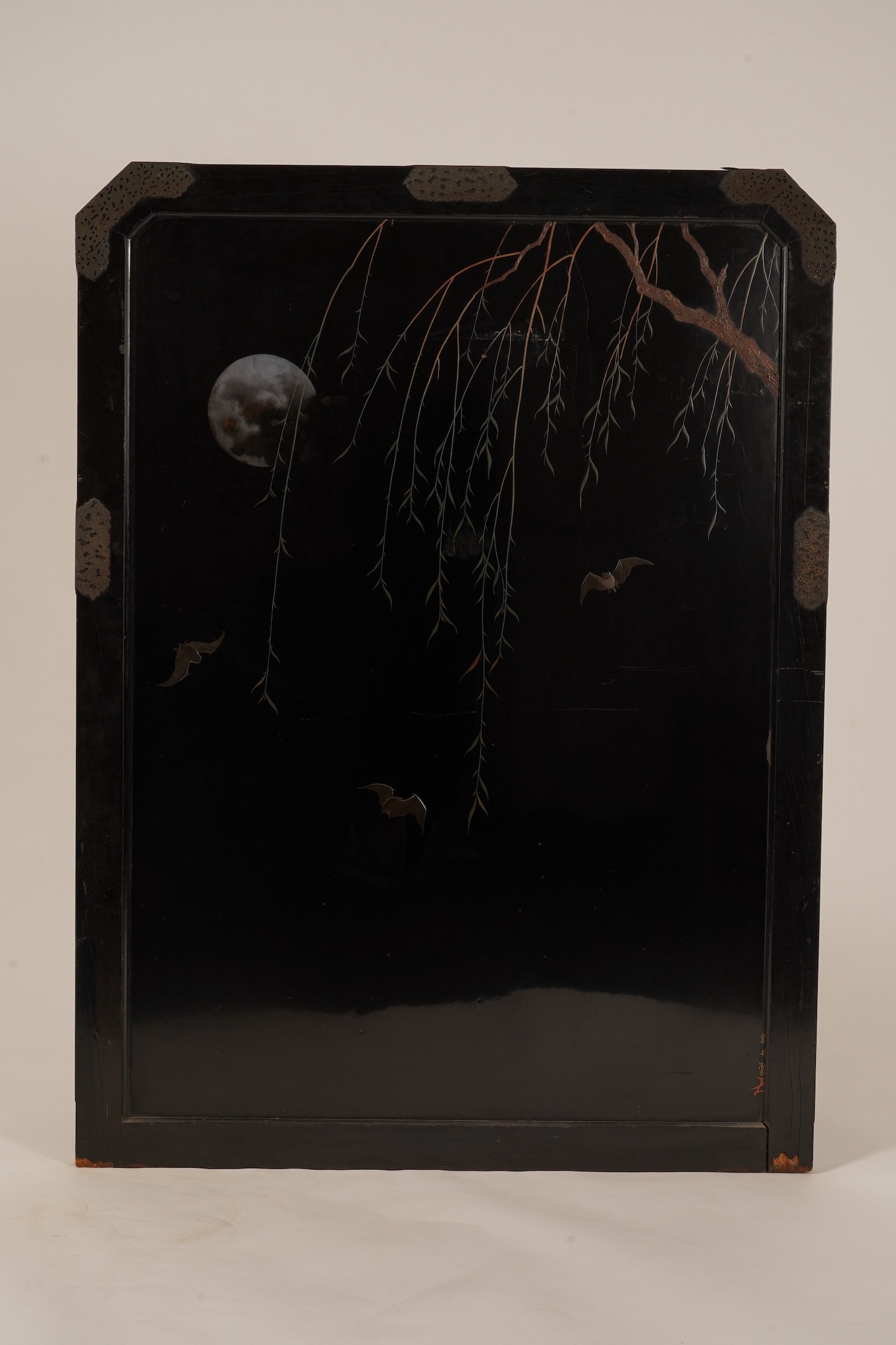 A Japanese inlaid persimmon wood tsuitate screen panel, Meiji period, possibly Tokyo School